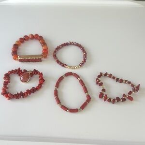Various bracelets stretchy in maroon family.
